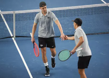 Tom Bittner and Chris Zhang celebrate after a play during a tennis match between the Montana Grizzlies and the Whitworth Pirates at the Peak Racquet Club in Missoula, Montana on January 20, 2024.