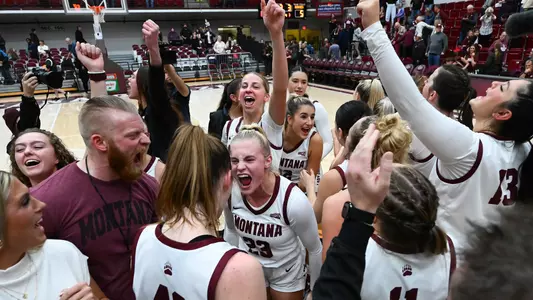 The Lady Griz celebrate after defeating Washington on Sunday Nov. 17, 2024, at Dahlberg Arena in Missoula, Montana.
