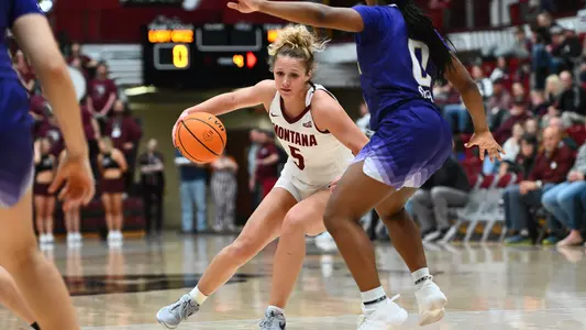 Tyler McCliment-Call #5 of the Montana Grizzlies drives the ball to the basket during the second half against Washington at Dahlberg Arena on Sunday, Nov. 17, 2024, in Missoula, Montana.