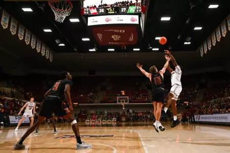 Money Williams #0 of the Montana Grizzlies shoot the ball during the second half between the Montana Grizzlies and Montana Tech at Robin Selvig Court inside Dahlberg Arena on December 10, 2024 in Missoula, Montana.