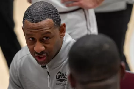 Head coach Travis DeCuire of the Montana Grizzlies looks on during a timeout in the second half of game against the Idaho Vandals at Robin Selvig Court inside Dahlberg Arena on February 1, 2024 in Missoula, Montana.