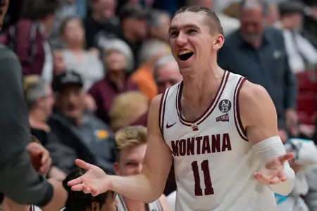 Aanen Moody #11 of the Montana Grizzlies reacts to a rebound during the second half of game against the Idaho Vandals at Robin Selvig Court inside Dahlberg Arena on February 1, 2024 in Missoula, Montana.