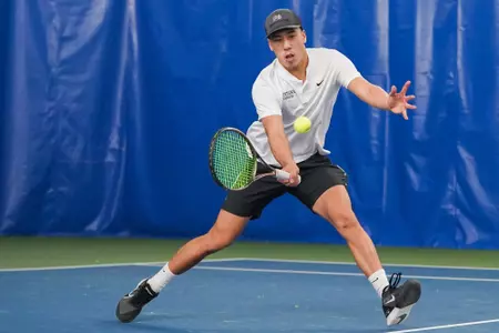 Chris Zhang of The Montana Grizzlies hits the ball during a match against the Whitman Blues on Feb. 10, 2024 at the PEAK Racquet Club in Missoula, Montana.