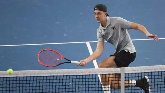 Tom Bittner hits the ball during a tennis match between the Montana Grizzlies and the Whitworth Pirates at the Peak Racquet Club in Missoula, Montana on January 20, 2024.