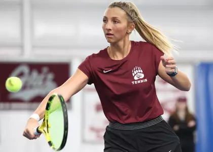Rosie Sterk of the Montana Grizzlies hits the ball during a match against the Utah State Aggies on Feb. 16, 2024, at the PEAK Racquet Club in Missoula, Montana.