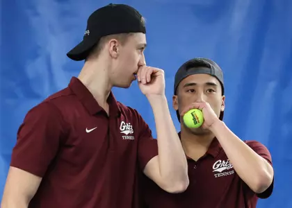 Tom Bittner and Chris Zhang strategize during a doubles match against the Grand Canyon Lopes at PEAK Racquet Club on February 4, 2024, in Missoula, Montana.