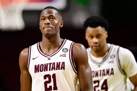 Laolu Oke #21 of the Montana Grizzlies reacts after losing to the Montana State Bobcats 85-70 at Idaho Central Arena on March 13, 2024 in Boise, Idaho.