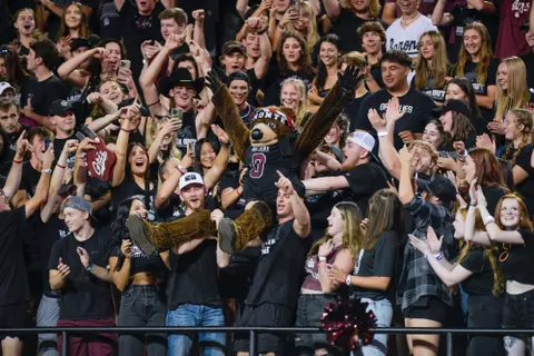 The University of Montana student section lifts up the school’s mascot Monte during the third quarter of a college football game between the Montana Grizzlies and the Ferris State Bulldogs at Washington-Grizzly Stadium on September 16, 2023 in Missoula, Montana.