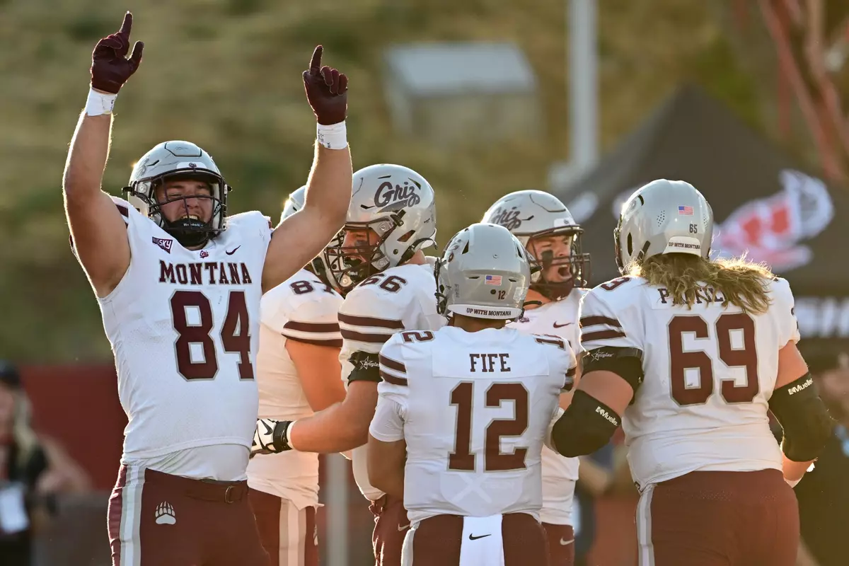 Evan Shafer #84 of the Montana Grizzlies celebrates a first quarter touchdown from Erik Barker #88 during the game against the Eastern Washington Eagles at Roos Field on September 28, 2024 in Cheney, Washington.