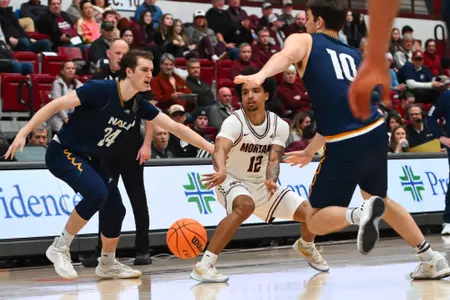 Brandon Whitney #12 of the Montana Grizzlies passes the ball during the second half between the Montana Grizzlies and Northern Arizona University at Robin Selvig Court inside Dahlberg Arena on January 9, 2024 in Missoula, Montana.