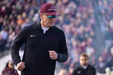 Bobby Hauck of the Montana Grizzlies takes the field before the game against the South Dakota Coyotes at Washington-Grizzly Stadium on December 13, 2025 in Missoula, Montana.