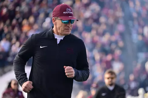 Bobby Hauck of the Montana Grizzlies takes the field before the game against the South Dakota Coyotes at Washington-Grizzly Stadium on December 13, 2025 in Missoula, Montana.
