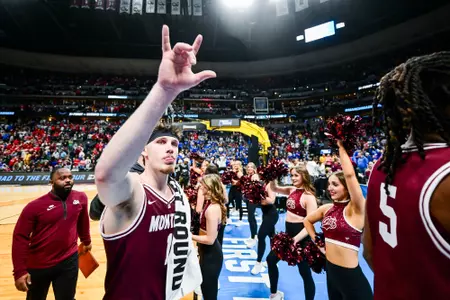 Kai Johnson #1 of the Montana Grizzlies reacts after an 85-66 loss to the Wisconsin Badgers in the First Round of the NCAA Tournament at Ball Arena in Denver, Colorado on March 19, 2025.