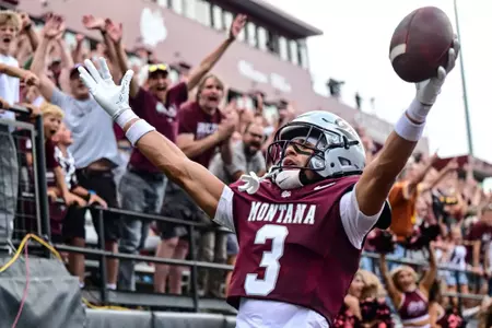 MISSOULA, MONTANA - SEPTEMBER 13: Wide receiver Brooks Davis #3 of the Montana Grizzlies celebrates after catching the game-winning touchdown against the North Dakota Fighting Hawks at Washington-Grizzly Stadium on September 13, 2025, in Missoula, Montana.