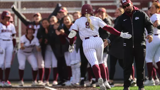 The University of Montana Grizzlies softball team takes on Carroll College in an exaction game, at the University of Montana, in Missoula.