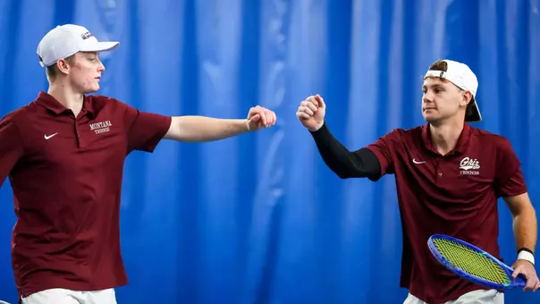 The University of Montana Grizzly tennis team takes on Utah State University at a home meet on January 25, 2026 in Missoula, Montana.