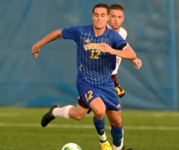 Aaron Long dribbling