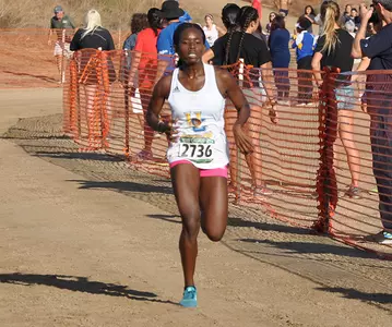Faith Makau Crossing FInish Line