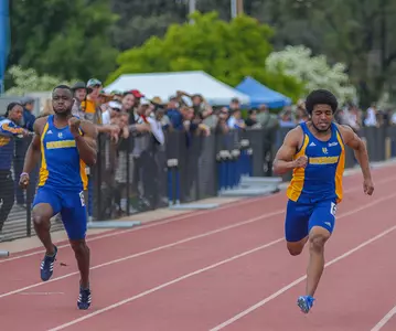 Charles Wheeler and Carlos Wedlow Crossing Finish Line