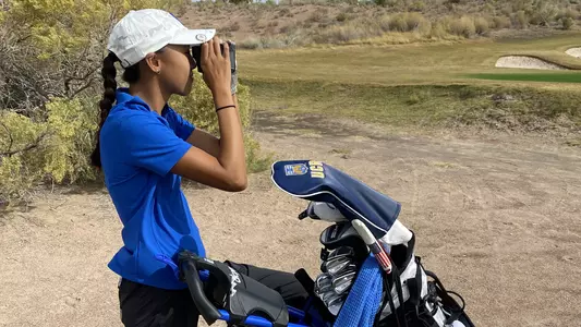 Tiffany Le measuring the distance at Clash at Boulder Creek.