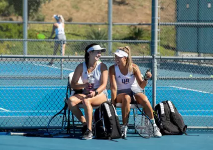 UCRÕs womenÕs tennis team members Mahli Silpachai, left, and Hanh Pham have a laugh together before competing against Long Beach State on February 18, 2022, at UC Riverside.
(UCR/Stan Lim)