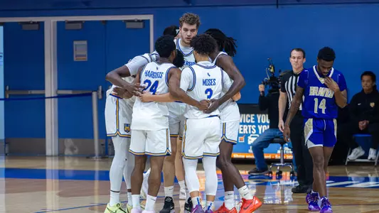 Men's Basketball Team Huddle