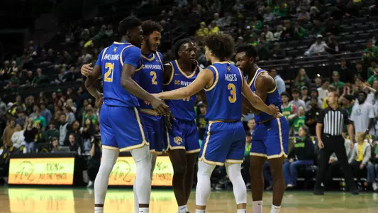 Men's Basketball Team Huddle