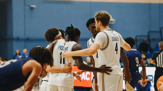 Men's Basketball Team Huddle