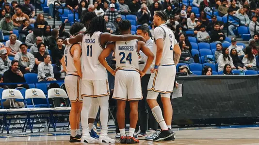 Men's Basketball Team Huddle