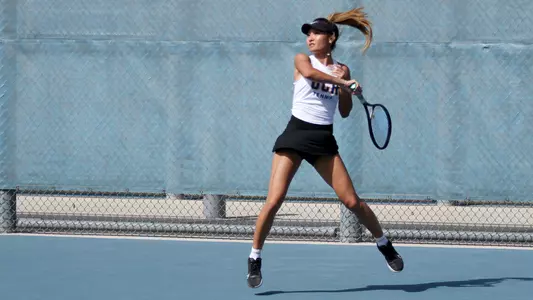 Chloe Vu on the baseline against Lehigh