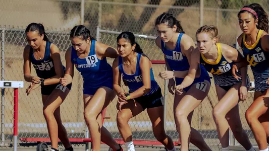 Isabella Carranza and Sophia Budd line up at the starting line for UC Riverside Track & Field