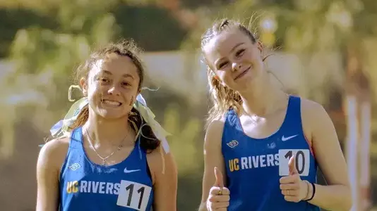UC Riverside Track & Field teammates Lexi Corvese and Genevieve Megow pose for a photo at the 2025 RCC Invitational in Riverside, California