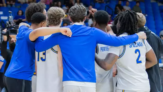 Men's Basketball Team Huddle