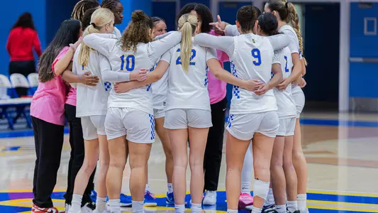 Womens Basketball Team huddle