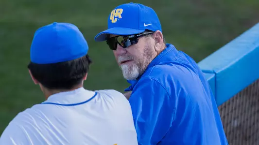 Troy Percival in the dugout talking to a player