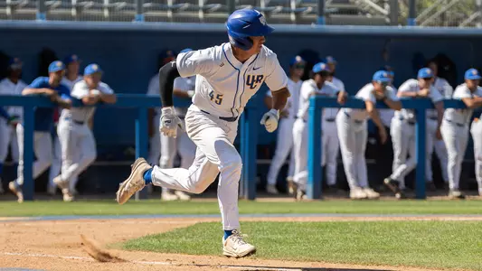 Evan Hall running to first