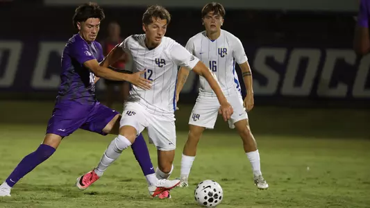 Brady Elliott holds off defenders at GCU