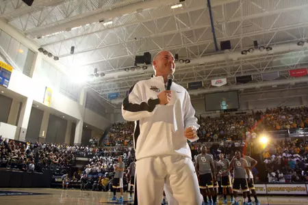 Men's basketball head coach Buzz Williams addresses the capacity crowd Friday night at the Al McGuire Center