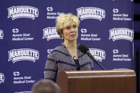 Head coach Terri Mitchell speaks with the media