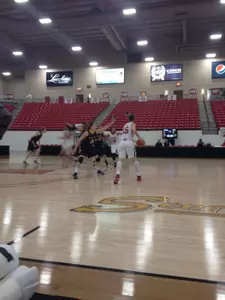 Katherine Plouffe guarding her twin sister, Michelle