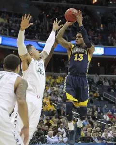 Vander Blue scored 14 points as Marquette cruised by Miami.