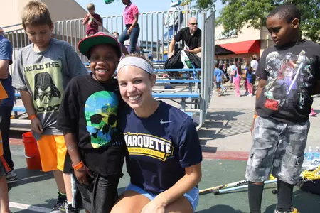 Redshirt junior Jennifer Zandlo with a festival attendee. Photo credit: Jordy Kirr
