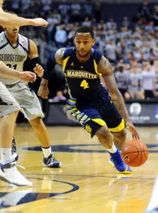 Todd Mayo's 3-pointer with eight seconds remaining in regulation sent the game to overtime en route to Marquette's first road win in the BIG EAST this season.