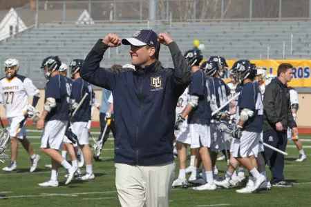 Brundage was promoted to associate head coach.