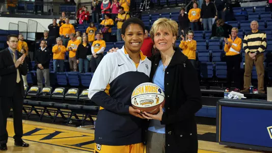 Junior Arlesia Morse was honored with her 1,000th career point basketball prior to the game.