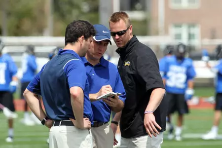 Head coach Joe Amplo (center) leads the Golden Eagles into their second season of NCAA Div. I competition this Saturday at Lehigh