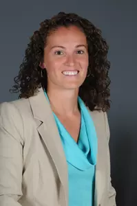 Carolyn Kieger returns to her alma mater as its fifth head women's basketball coach.