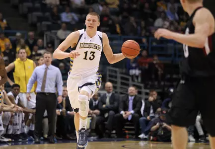 Henry Ellenson had a double-double by halftime in his first game on the Al McGuire Court.