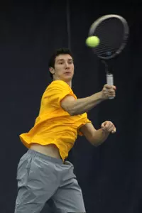 Freshman Andre Romanello clinched in singles and doubles Friday night.