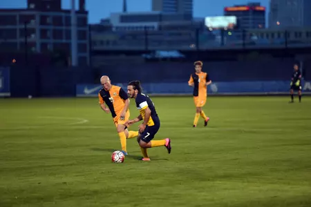 Kelmend Islami (7) dribbles alongside Louis Bennett II (19) in the 2015 Blue & Gold game.